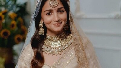 Alia Bhatt: New mom Alia Bhatt wore a Manish Malhotra lehenga for her wedding. Her bridal trousseau consisted of an ivory organza saree embroidered with tilla work. She teamed her look with a hand-woven tissue veil.&nbsp; (Instagram/@aliaabhatt)