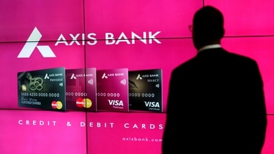 A visitor watches an Axis Bank's advertisement at its corporate headquarters in Mumbai. (REUTERS)