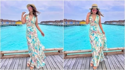 Hina accessorised the maxi dress with a tan straw hat featuring a black and white polka-dot band, hoop earrings with heart ornaments, pink-tinted broad sunglasses, printed slip-on sandals, and a silver ring. (Instagram) Hina accessorised the maxi dress with a tan straw hat featuring a black and white polka-dot band, hoop earrings with heart ornaments, pink-tinted broad sunglasses, printed slip-on sandals, and a silver ring. (Instagram)