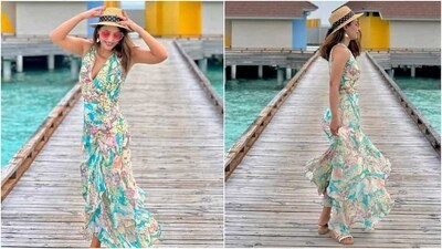 Recently, Hina Khan posted photos of herself on Instagram with the caption, "Perfect place in paradise." The pictures show Hina enjoying a breezy morning in the Maldives while posing on a wooden dock by the clear blue sea. She chose a floral look for chilling in the island nation. (Instagram) Recently, Hina Khan posted photos of herself on Instagram with the caption, "Perfect place in paradise." The pictures show Hina enjoying a breezy morning in the Maldives while posing on a wooden dock by the clear blue sea. She chose a floral look for chilling in the island nation. (Instagram)