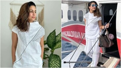 Hina wore a white printed blouse with matching baggy trousers for the jet-set look. She rounded it off with chunky sneakers, a broad strap watch, a Louis Vuitton handbag, tinted sunglasses, a no-makeup look, nude lip shade, and silver ear studs. (Instagram) Hina wore a white printed blouse with matching baggy trousers for the jet-set look. She rounded it off with chunky sneakers, a broad strap watch, a Louis Vuitton handbag, tinted sunglasses, a no-makeup look, nude lip shade, and silver ear studs. (Instagram)