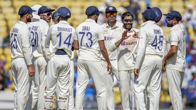 India's Ravindra Jadeja, third right without cap, celebrates with teammates the dismissal of Australia's captain Pat Cummins (AP)