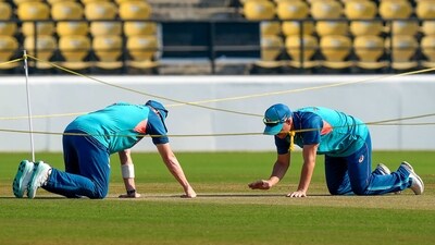 Australia captain Pat Cummins with teammate David Warner examines the pitch during a practice session ahead of the 1st Test in Nagpur (PTI) Australia captain Pat Cummins with teammate David Warner examines the pitch during a practice session ahead of the 1st Test in Nagpur (PTI)