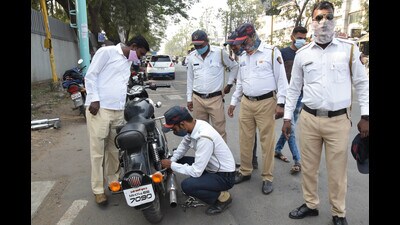 Police inspect the silencer of a bullet. (HT FILE PHOTO) Police inspect the silencer of a bullet. (HT FILE PHOTO)