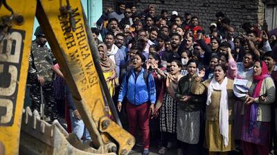 Residents protest against the anti-encroachment drive by DDA at Meharauli in New Delhi on Saturday. (Raj K Raj/HT PHOTO)