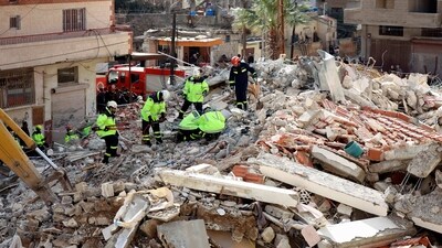 Rescuers sift through the rubble of a collapsed building in the town of Jableh in the province of Latakia, (AFP) Rescuers sift through the rubble of a collapsed building in the town of Jableh in the province of Latakia, (AFP)