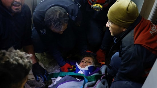 Nezihe Sevinc, a 68-year-old woman, is rescued alive from the rubble in the aftermath of a deadly earthquake in Hatay, Turkey on Friday. (Reuters)