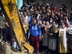 Residents protest against the anti-encroachment drive by DDA at Meharauli in New Delhi on Saturday. (Raj K Raj/HT PHOTO) Residents protest against the anti-encroachment drive by DDA at Meharauli in New Delhi on Saturday. (Raj K Raj/HT PHOTO)