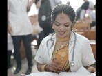 Indian bride giving her practical exam in her wedding dress. Indian bride giving her practical exam in her wedding dress.