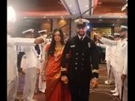 Lt Neil and Parvathy are being welcomed by Navy officers with an arch of sabers. Lt Neil and Parvathy are being welcomed by Navy officers with an arch of sabers.