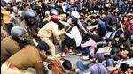 Police personnel detain protestors during the demonstration (ANI Photo)