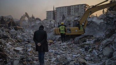 A man stands on top of the rubble of his house destroyed during an earthquake in Antakya, southeastern Turkey. (AP) A man stands on top of the rubble of his house destroyed during an earthquake in Antakya, southeastern Turkey. (AP)