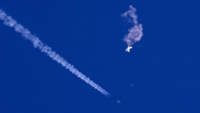 Chinese Spy Balloon: Remnants of a large balloon drift above the Atlantic Ocean, just off the coast of South Carolina, with a fighter jet and its contrail seen. (AP) Chinese Spy Balloon: Remnants of a large balloon drift above the Atlantic Ocean, just off the coast of South Carolina, with a fighter jet and its contrail seen. (AP)