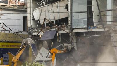 An automobile showroom being demolished in Jammu. (PTI) An automobile showroom being demolished in Jammu. (PTI)