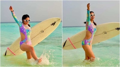 Hina's swimsuit features sea-inspired patterns in neon colours like green, blue, pink, purple, yellow, and lavender. She wore the bodycon monokini with quirky white sunglasses that gave off retro vibes. (Instagram) Hina's swimsuit features sea-inspired patterns in neon colours like green, blue, pink, purple, yellow, and lavender. She wore the bodycon monokini with quirky white sunglasses that gave off retro vibes. (Instagram)