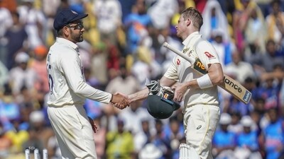 Australia's Steve Smith, right, shakes hands India's captain Rohit Sharma after India won the first cricket test match (AP) Australia's Steve Smith, right, shakes hands India's captain Rohit Sharma after India won the first cricket test match (AP)