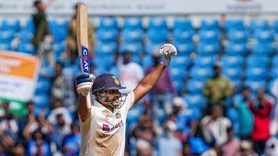 Indian captain Rohit Sharma celebrates his century during the 2nd day of the 1st test match between India and Australia (PTI) Indian captain Rohit Sharma celebrates his century during the 2nd day of the 1st test match between India and Australia (PTI)