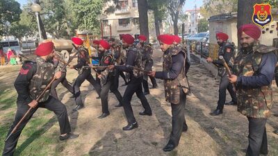 Police personnel practising defence and attack techniques near the Chandigarh-Mohali border on Sunday. (HT Photo)