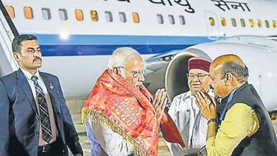 Prime Minister Narendra Modi received by Karnataka CM Basavaraj Bommai at HAL Airport, in Bengaluru on Sunday. (PTI)