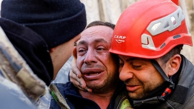 Turkey-Syria Earthquake: A man reacts next to rescuers in the aftermath of a deadly earthquake in Hatay, Turkey. (Reuters)