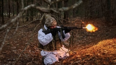 A Ukrainian serviceman attends a joint drills of armed forces, national guard and Security Service of Ukraine (SBU) near the border with Belarus on Saturday. (Reuters)