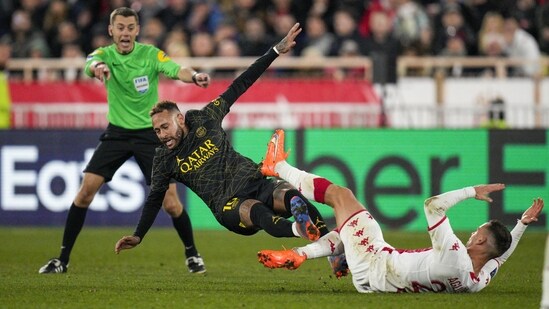 PSG's Neymar, center, and Monaco's Ruben Aguilar fight for the ball during a French League One soccer match (AP)