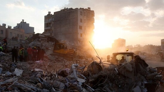 Turkey-Syria Earthquake LIVE updates: Members of a rescue team work on the site of a collapsed building, as the search for survivors continues, in the aftermath of a deadly earthquake, in Iskenderun, Turkey.