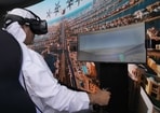 A man experiences a driving simulator of a flying taxi during the World Government Summit in Dubai on Monday, (AP) A man experiences a driving simulator of a flying taxi during the World Government Summit in Dubai on Monday, (AP)