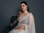 For the reception, Kajol wore a glittering embellished sari, paired with traditional earrings. For the reception, Kajol wore a glittering embellished sari, paired with traditional earrings.