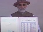 PM Modi releases Aero India 2023 commemorative stamp. (screengrab) PM Modi releases Aero India 2023 commemorative stamp. (screengrab)