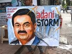 A painting of Gautam Adani in Mumbai highlights the ongoing crisis of the Adani group. (AFP)