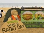 Sand artist Sudarsan Pattnaik created a special sculpture on the eve of World Radio Day at Puri beach on Sunday. (PTI) Sand artist Sudarsan Pattnaik created a special sculpture on the eve of World Radio Day at Puri beach on Sunday. (PTI)