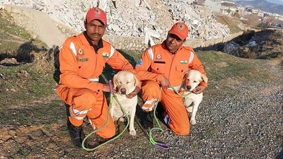 NDRF personnel with their dogs Romeo and Julie who helped in rescuing a six year old girl from the rubble during a search and rescue operation in the quake hit Turkey. (ANI Picture Service) NDRF personnel with their dogs Romeo and Julie who helped in rescuing a six year old girl from the rubble during a search and rescue operation in the quake hit Turkey. (ANI Picture Service)