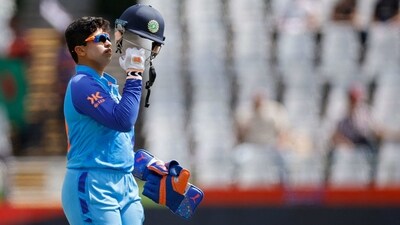 Richa Ghosh puts her helmet during Group B T20 Women's World Cup match against Pakistan (AFP)