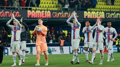 Barcelona's players celebrate victory at the end of the Spanish League football match between Villarreal CF and FC Barcelona (AFP) Barcelona's players celebrate victory at the end of the Spanish League football match between Villarreal CF and FC Barcelona (AFP)