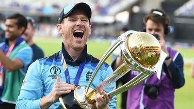 Eoin Morgan celebrates with the World Cup trophy on the pitch after the 2019 Cricket World Cup final (AFP)