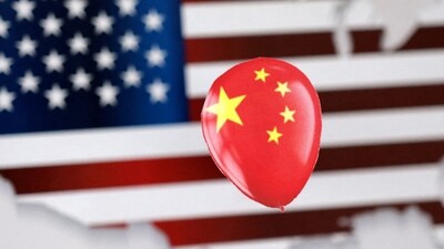 Chinese Spy Balloon: A printed balloon with Chinese flag is placed on a US flag in the shape of US map outline, in this illustration. (Reuters)
