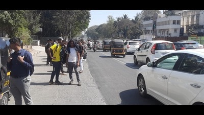 Students at a bus stop without shelter. (HT PHOTO)