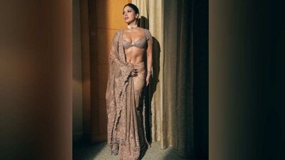 Her golden-coloured traditional attire features an embellished deep sweetheart neck blouse with zari work and golden tassels on the sleeves, the golden saree style pleated lehenga comes adorned with heavy embroidery and zari work. She completed the outfit with the matching zari dupatta traditionally draped on the shoulders. (Instagram/@bhumipedneker) Her golden-coloured traditional attire features an embellished deep sweetheart neck blouse with zari work and golden tassels on the sleeves, the golden saree style pleated lehenga comes adorned with heavy embroidery and zari work. She completed the outfit with the matching zari dupatta traditionally draped on the shoulders. (Instagram/@bhumipedneker)