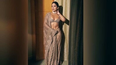 Bhumi displayed stunning poses for the camera. The actress brilliantly accentuates her toned body in the tunning shimmery saree. Her dress serves as the ideal source of wedding season inspiration. (Instagram/@bhumipedneker) Bhumi displayed stunning poses for the camera. The actress brilliantly accentuates her toned body in the tunning shimmery saree. Her dress serves as the ideal source of wedding season inspiration. (Instagram/@bhumipedneker)