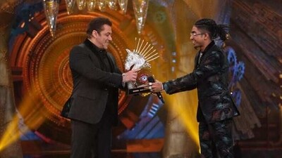 Salman Khan gives the Bigg Boss 16 winner's trophy to MC Stan.