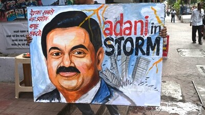 A painting of Gautam Adani in Mumbai highlights the ongoing crisis of the Adani group. (AFP) A painting of Gautam Adani in Mumbai highlights the ongoing crisis of the Adani group. (AFP)