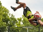 Longest barani flip bounce-pass relay for a forward flip slam dunk. Longest barani flip bounce-pass relay for a forward flip slam dunk.