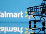 FILE PHOTO: Shopping trolley is seen in front of Walmart logo in this illustration.