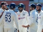 The Indian team celebrates taking a wicket against Australia in Nagpur