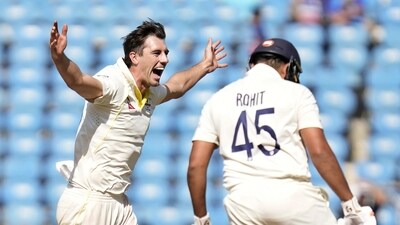 Australia's captain Pat Cummins, left, celebrates the dismissal of India's captain Rohit Sharma, right, during the second day of the first cricket test match between India and Australia in Nagpur, India, Friday, Feb. 10, 2023. (AP Photo/Rafiq Maqbool) (AP) Australia's captain Pat Cummins, left, celebrates the dismissal of India's captain Rohit Sharma, right, during the second day of the first cricket test match between India and Australia in Nagpur, India, Friday, Feb. 10, 2023. (AP Photo/Rafiq Maqbool) (AP)