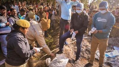 Kanpur Dehat: Members of Forensic Science Laboratory (FSL) team collect samples from the site, where a mother-daughter duo allegedly died by immolating themselves during an anti-encroachment drive on Monday, in Kanpur Dehat district, Tuesday, Feb. 14, 2023. (PTI Photo)(PTI02_14_2023_000163A) (PTI)
