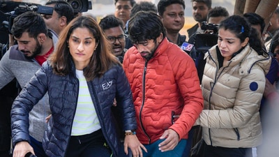 Wrestlers Vinesh Phogat, Sakshi Malik and Bajrang Punia arrive to sit on 'dharna' to protest against the Wrestling Federation of India (WFI), at Jantar Mantar in New Delhi on Thursday, (PTI) Wrestlers Vinesh Phogat, Sakshi Malik and Bajrang Punia arrive to sit on 'dharna' to protest against the Wrestling Federation of India (WFI), at Jantar Mantar in New Delhi on Thursday, (PTI)