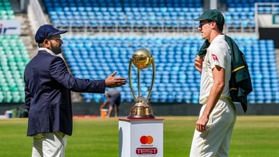 Indian captain Rohit Sharma interacts with his Australian counterpart Pat Cummins (PTI) Indian captain Rohit Sharma interacts with his Australian counterpart Pat Cummins (PTI)