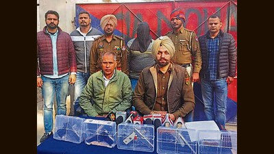 The accused with recovered arms in police custody. (HT Photo) The accused with recovered arms in police custody. (HT Photo)